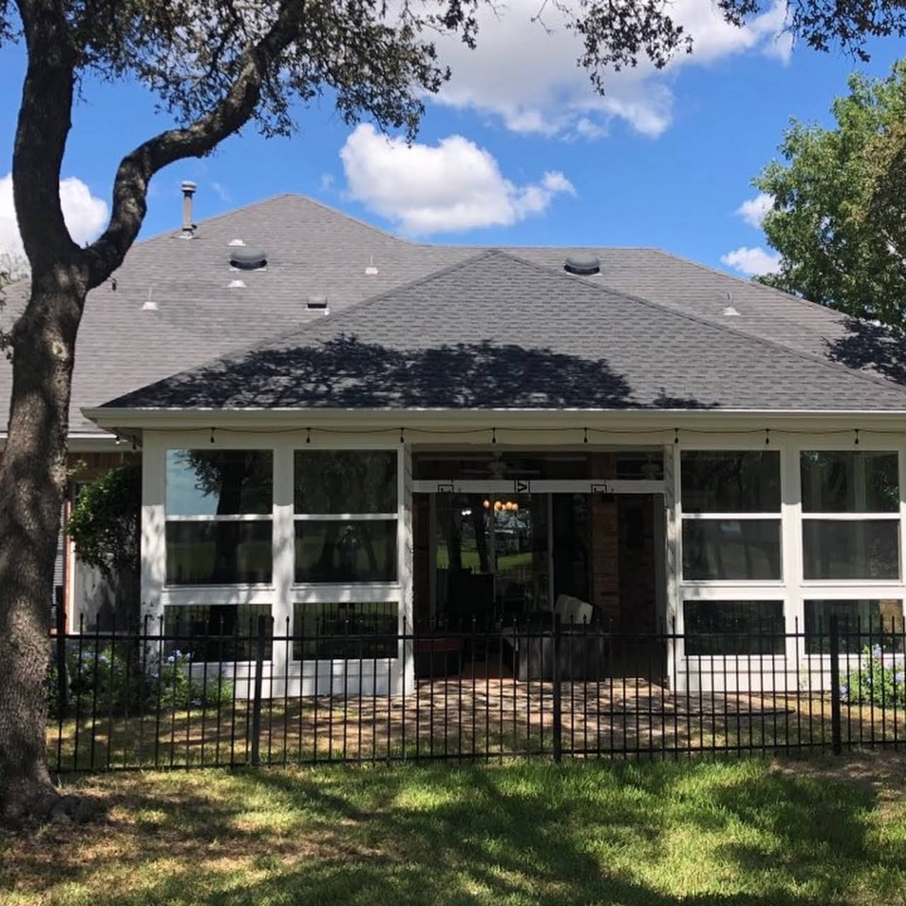 New home remodel with large windows and new roof