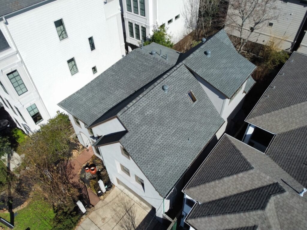An aerial view of a house in Austin, TX with a roof.